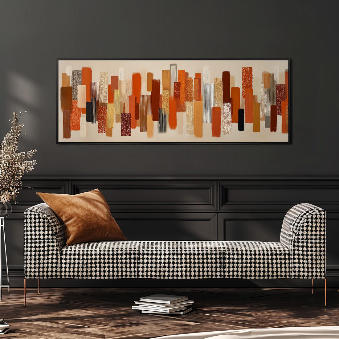 a large abstract painting hanging on a wall above a brown sofa with two pillows.
