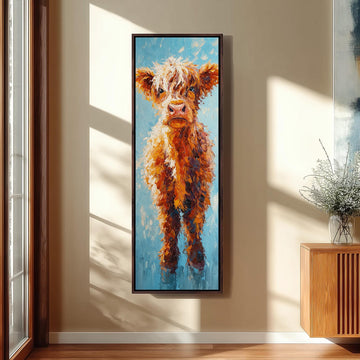 a large, colorful painting of a cow hanging on a wall in a room with a wooden cabinet below it.