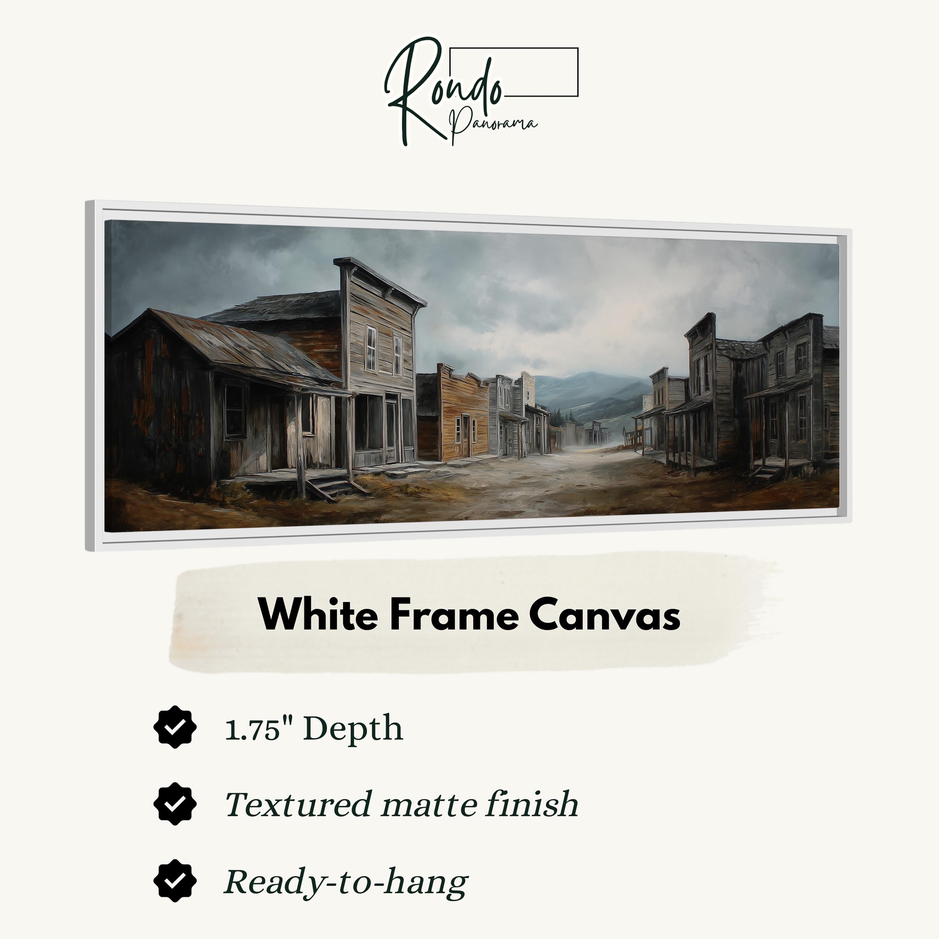 The image is a white frame canvas depicting a rural western town with old buildings, a dirt road, and a cloudy sky.