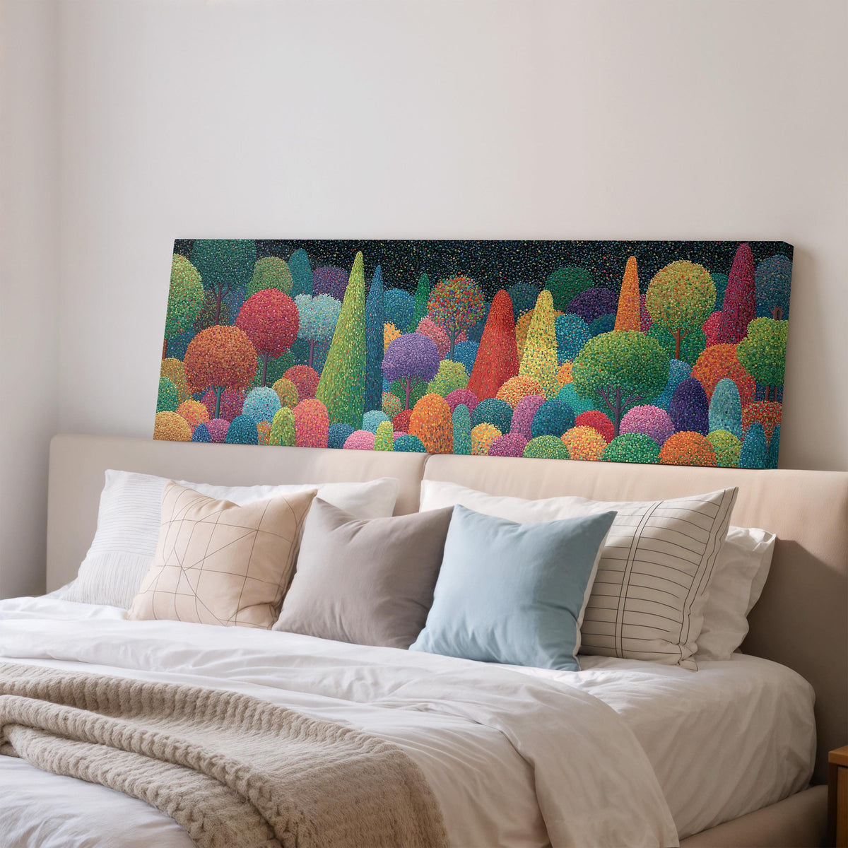 Whimsical rainbow pointillist forest wide panoramic canvas print above a bed in a bedroom