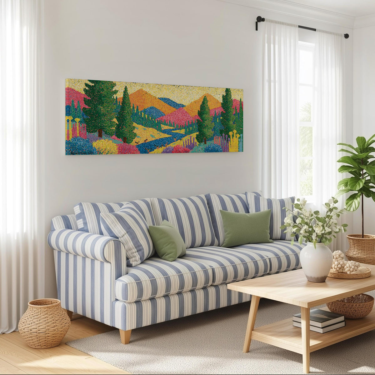 Colorful pine mountain valley long horizontal canvas print above a striped sofa in a coastal living room