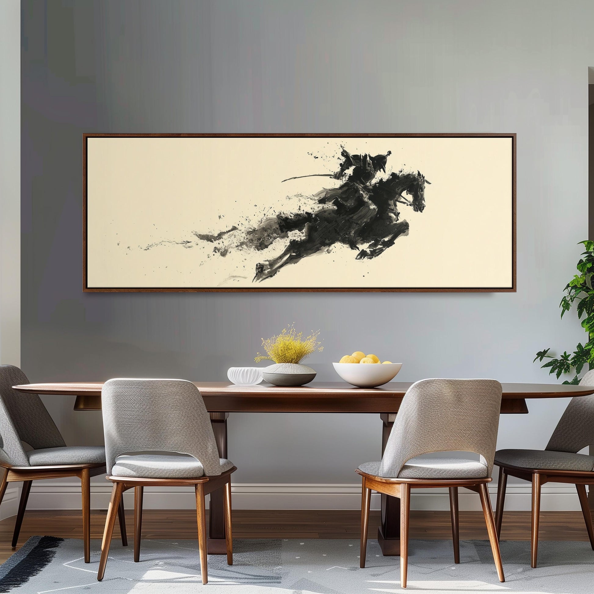 a dining room with a wooden table and four chairs. Above the table, there is a large black and white abstract painting depicting a horse in mid-gallop. The painting is framed and hangs on the wall above the table.