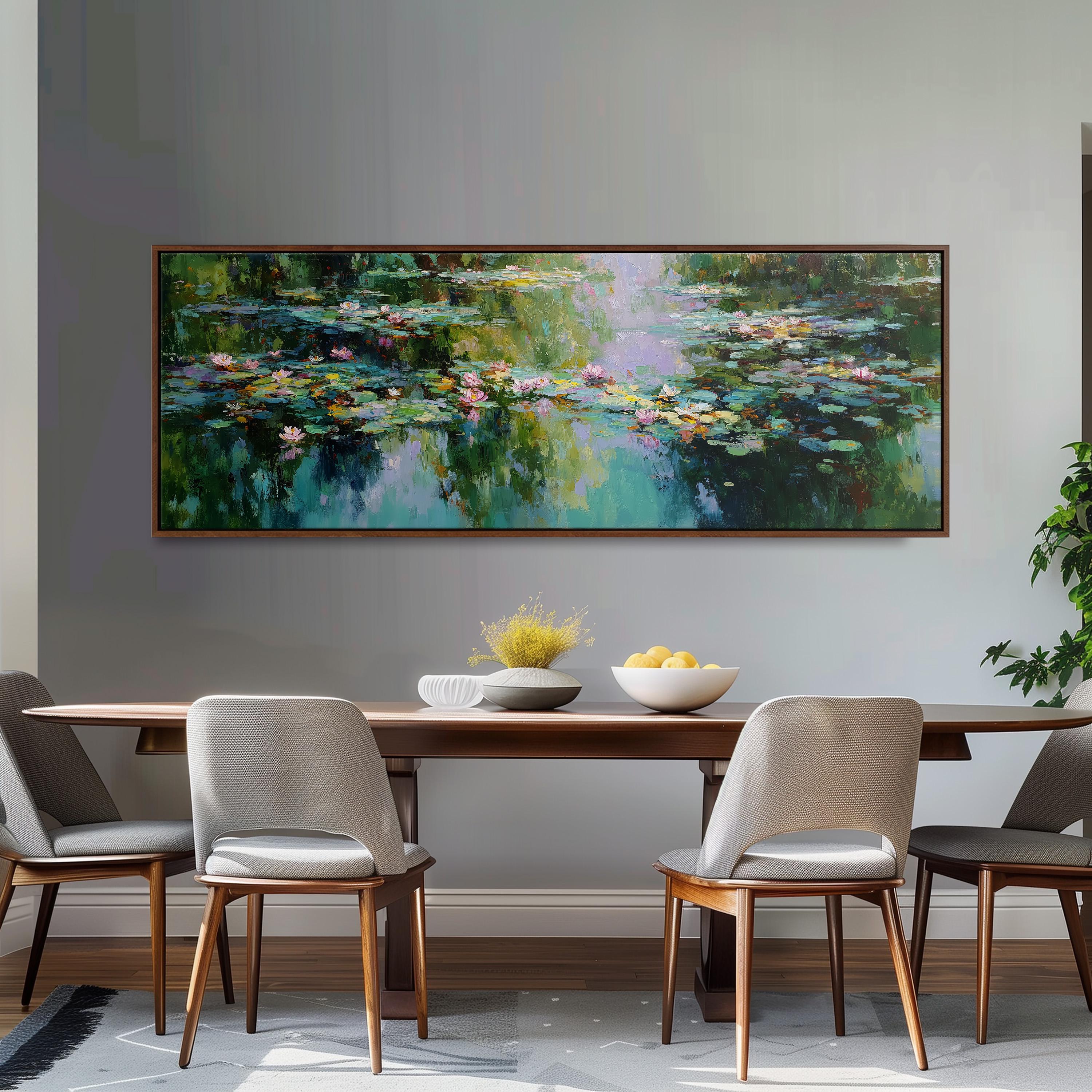 a dining room with a large painting of a pond with lily pads hanging on the wall above a wooden dining table with four chairs. The table is set with a bowl of fruit and a vase of flowers, creating a cozy and inviting atmosphere.