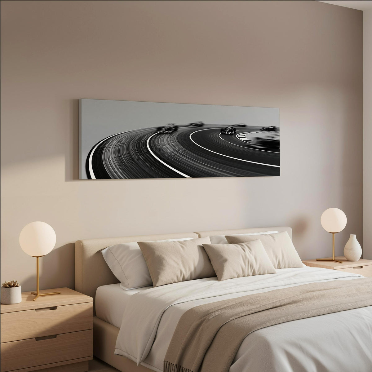 Race cars sweeping around a curve in black and white wide panoramic canvas print above a bed in a neutral bedroom