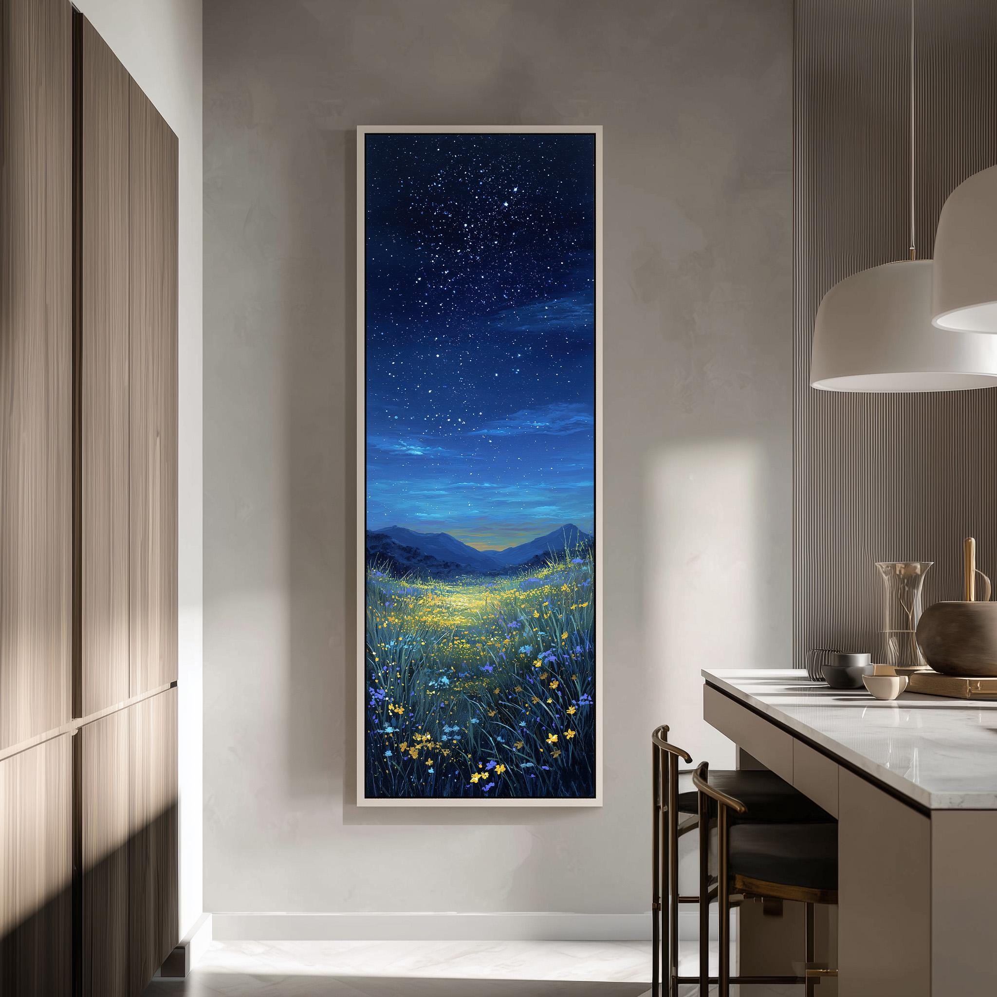 a large, framed painting of a night sky with stars and a field of flowers, hanging on a wall in a modern kitchen.