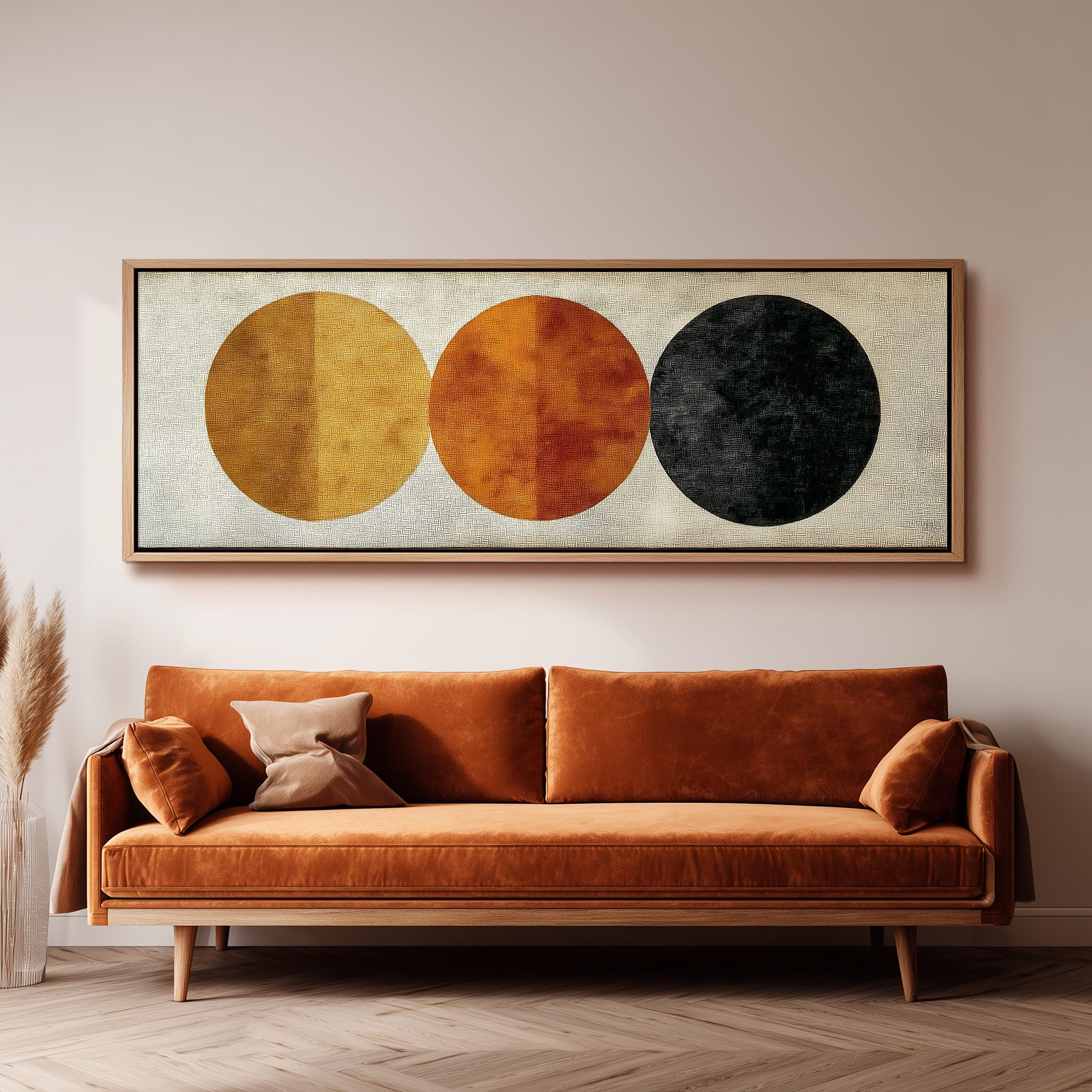 a large, rectangular painting hanging on a wall above a brown sofa with orange cushions.