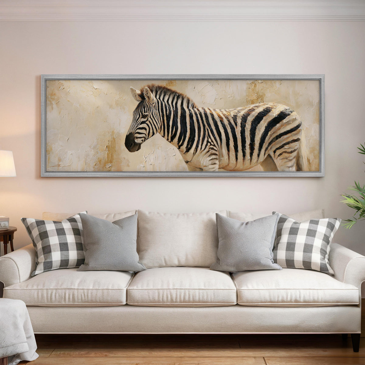 Zebra on a sandy textured background panoramic canvas print above a white sofa in a bright living room