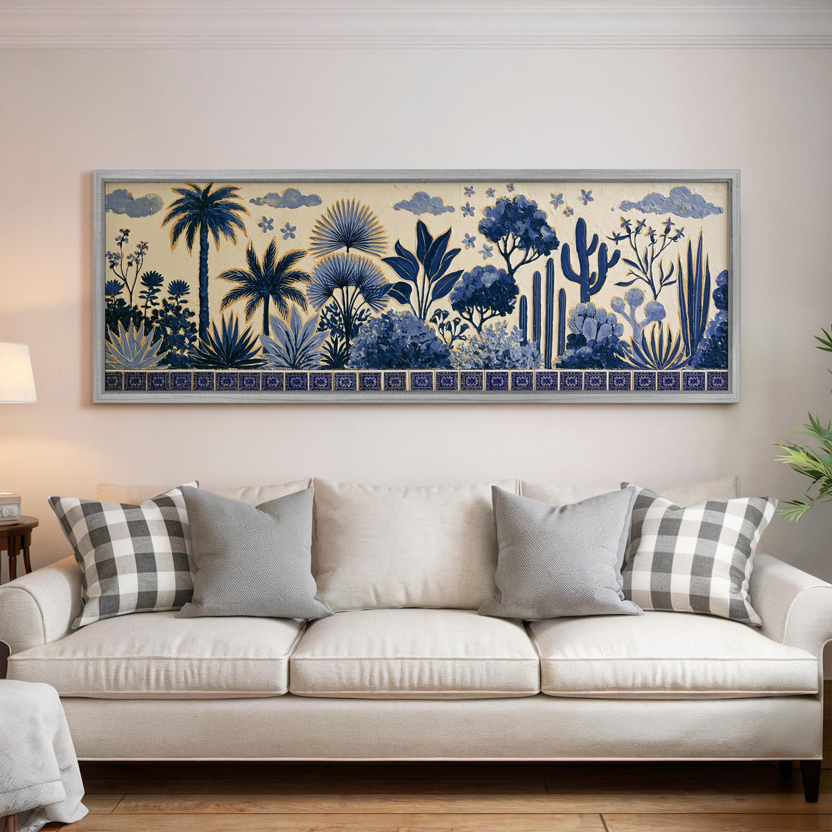 Blue palms, cacti and flowers pattern panoramic canvas print above a white sofa in a bright living room