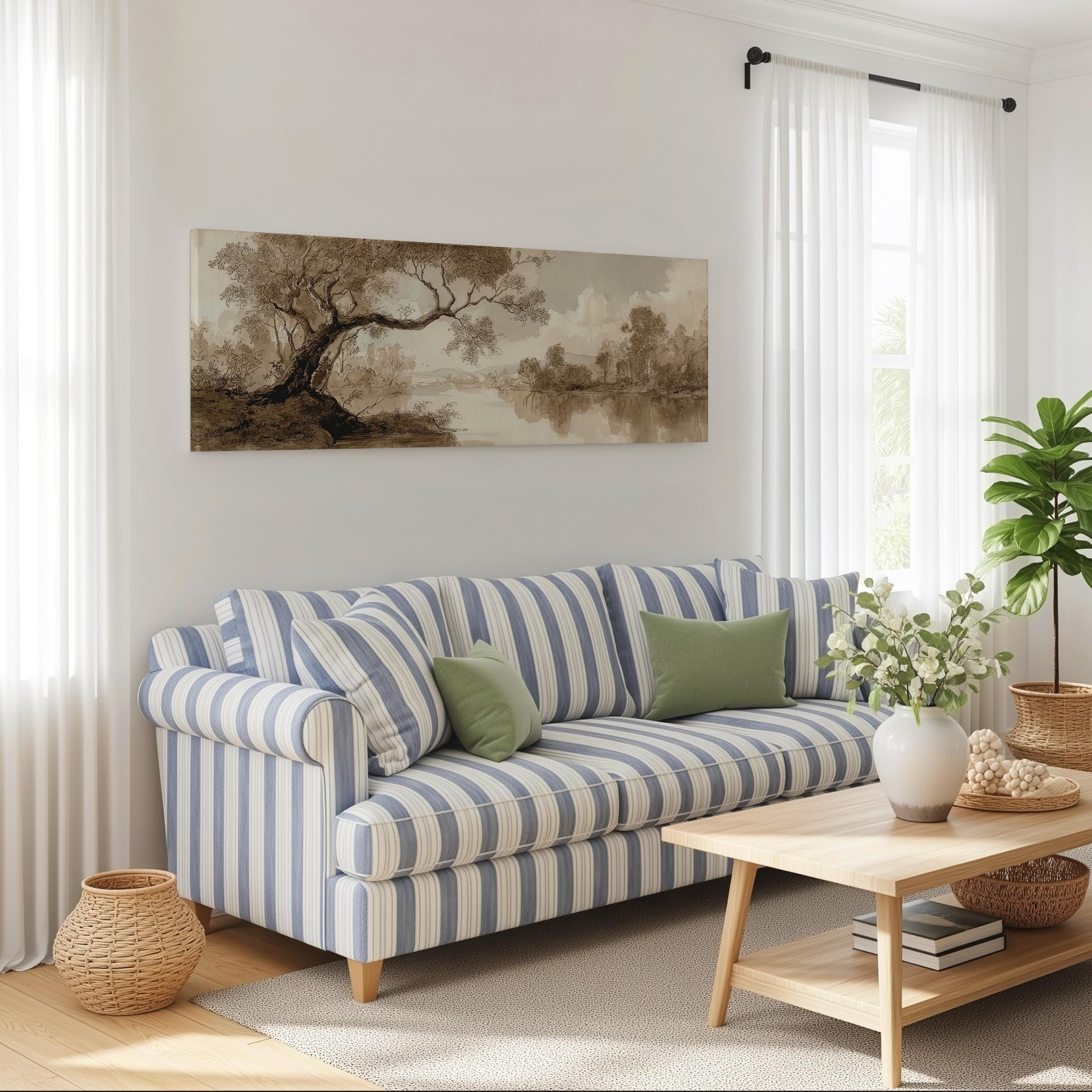 a cozy living room with a striped blue and white sofa, a wooden coffee table, and a large landscape painting on the wall.