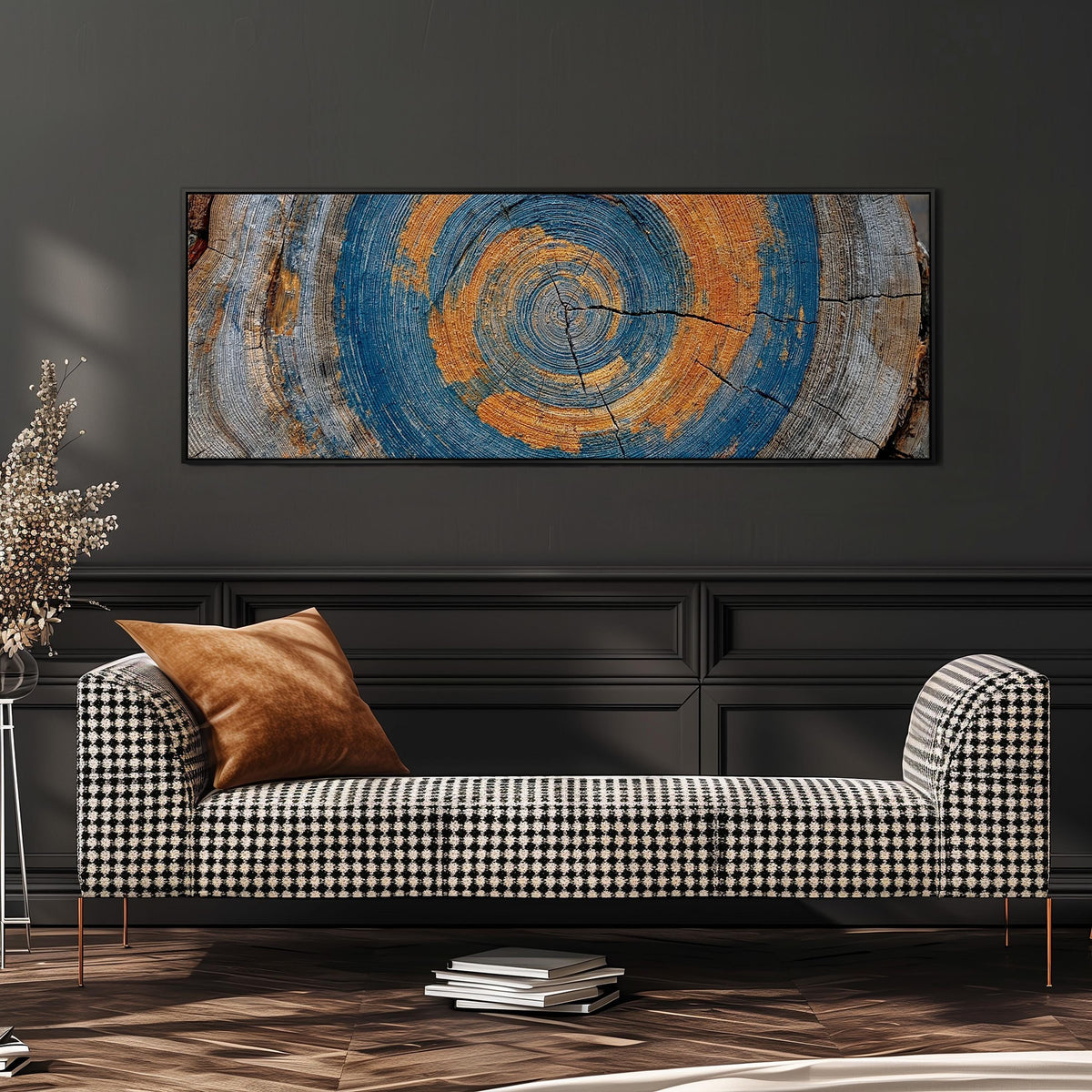 Blue and orange tree ring wide panoramic canvas print above a bench in a dark living room