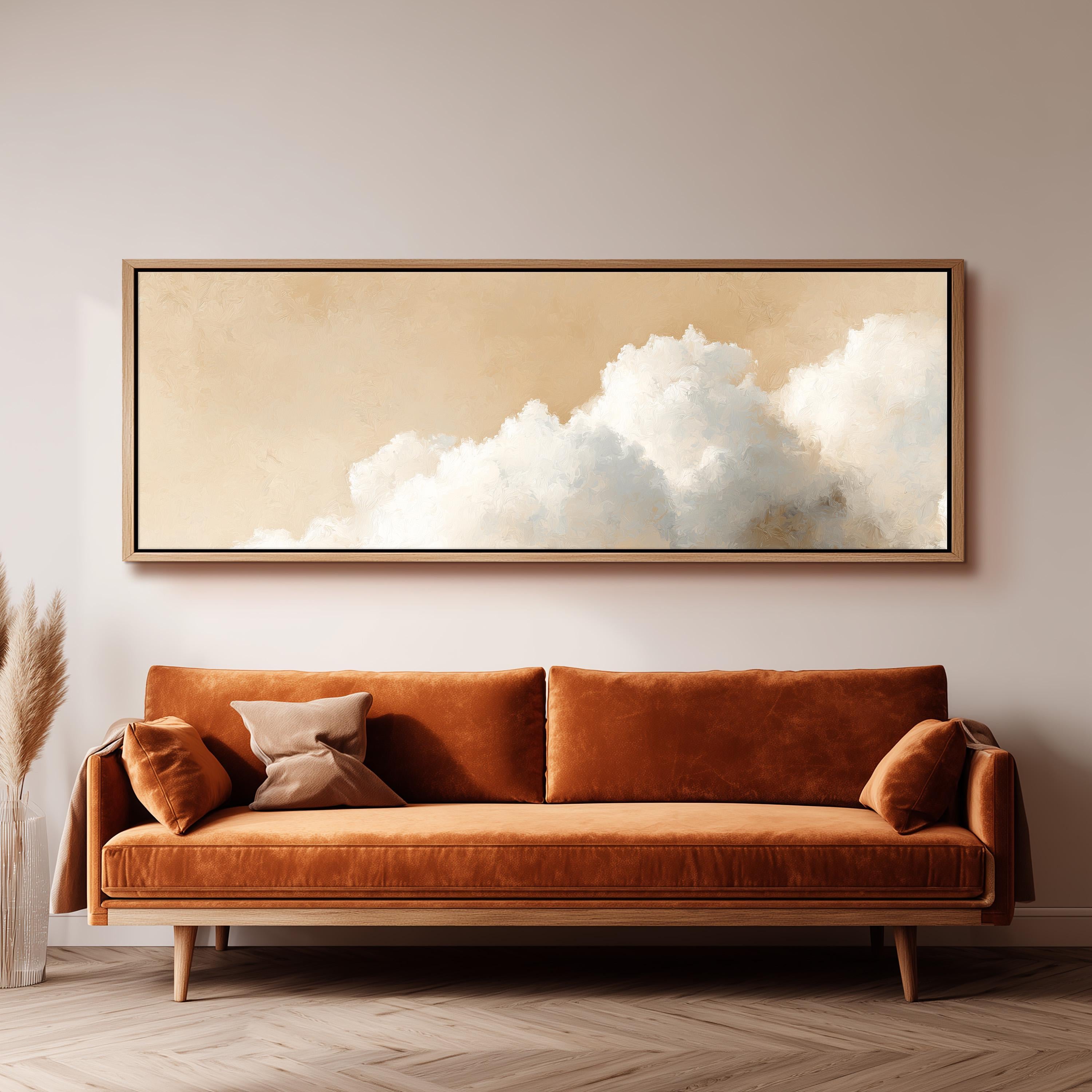 a large, framed painting of a cloudy sky hanging above a brown sofa with two pillows.