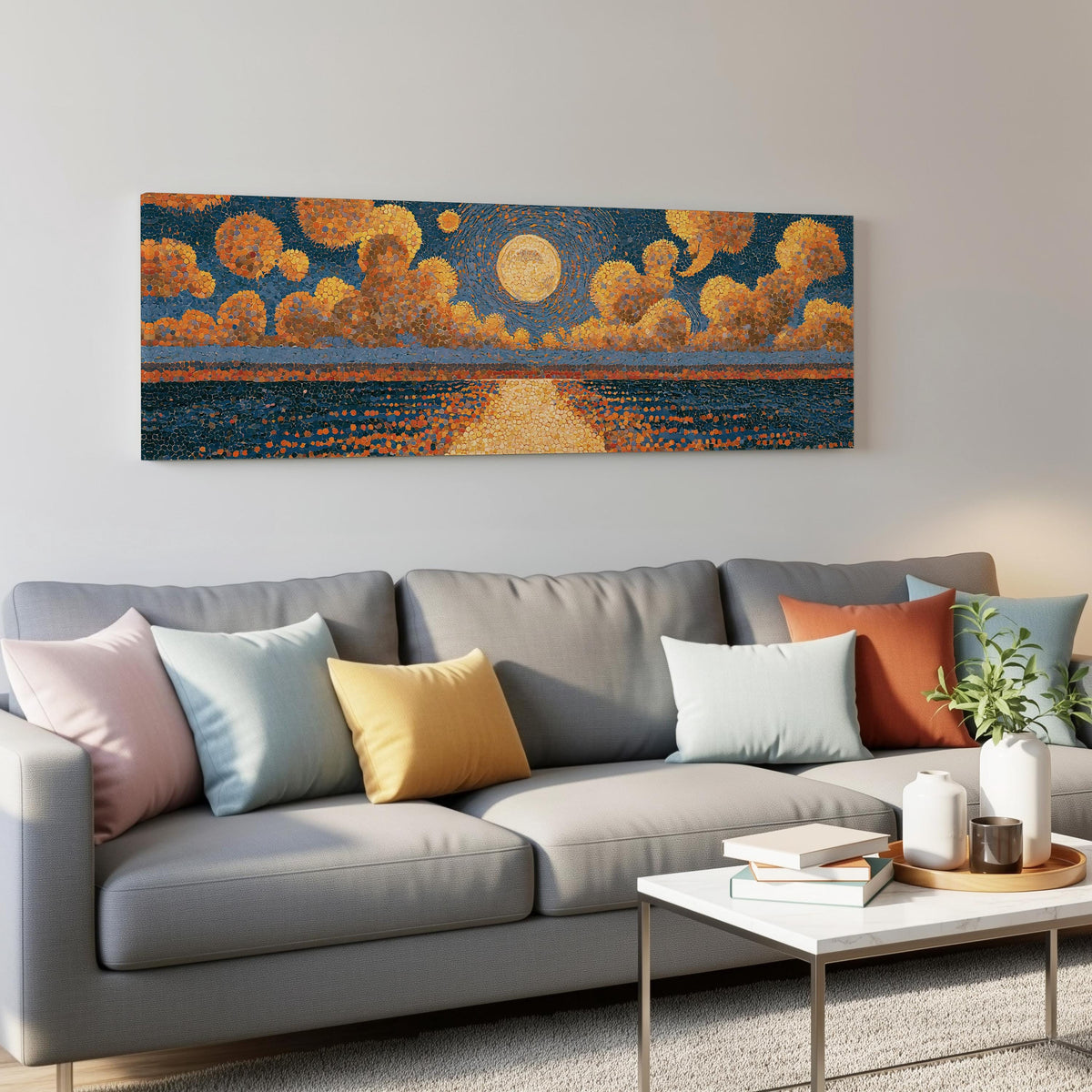 Golden sunset over a lake panoramic canvas print above a grey sofa in a living room
