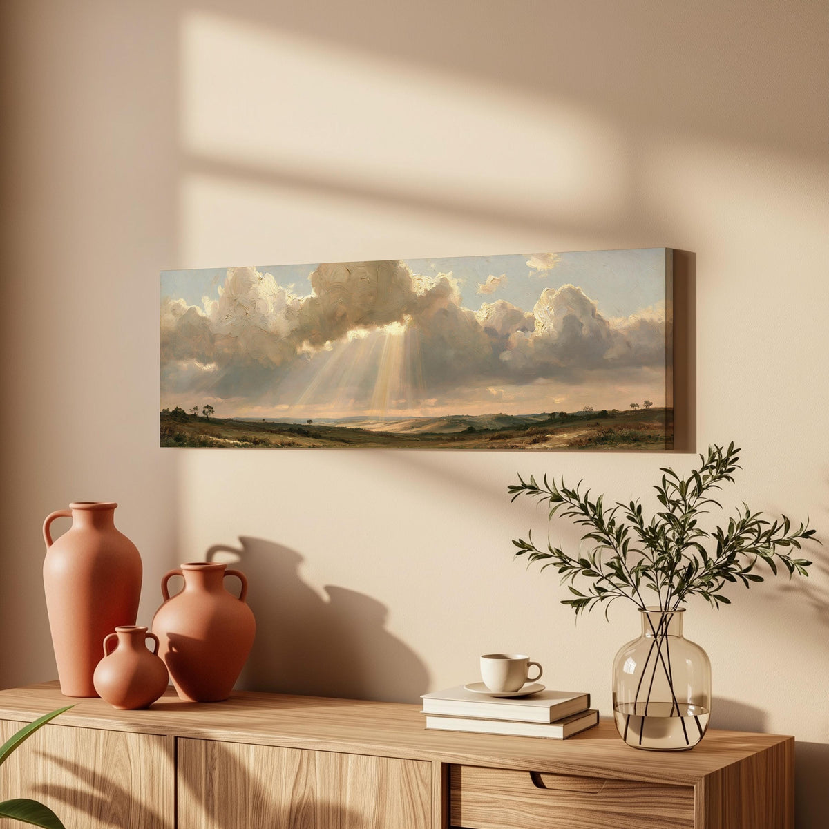 Sunbeams breaking through clouds over plains long horizontal canvas print above a wooden sideboard