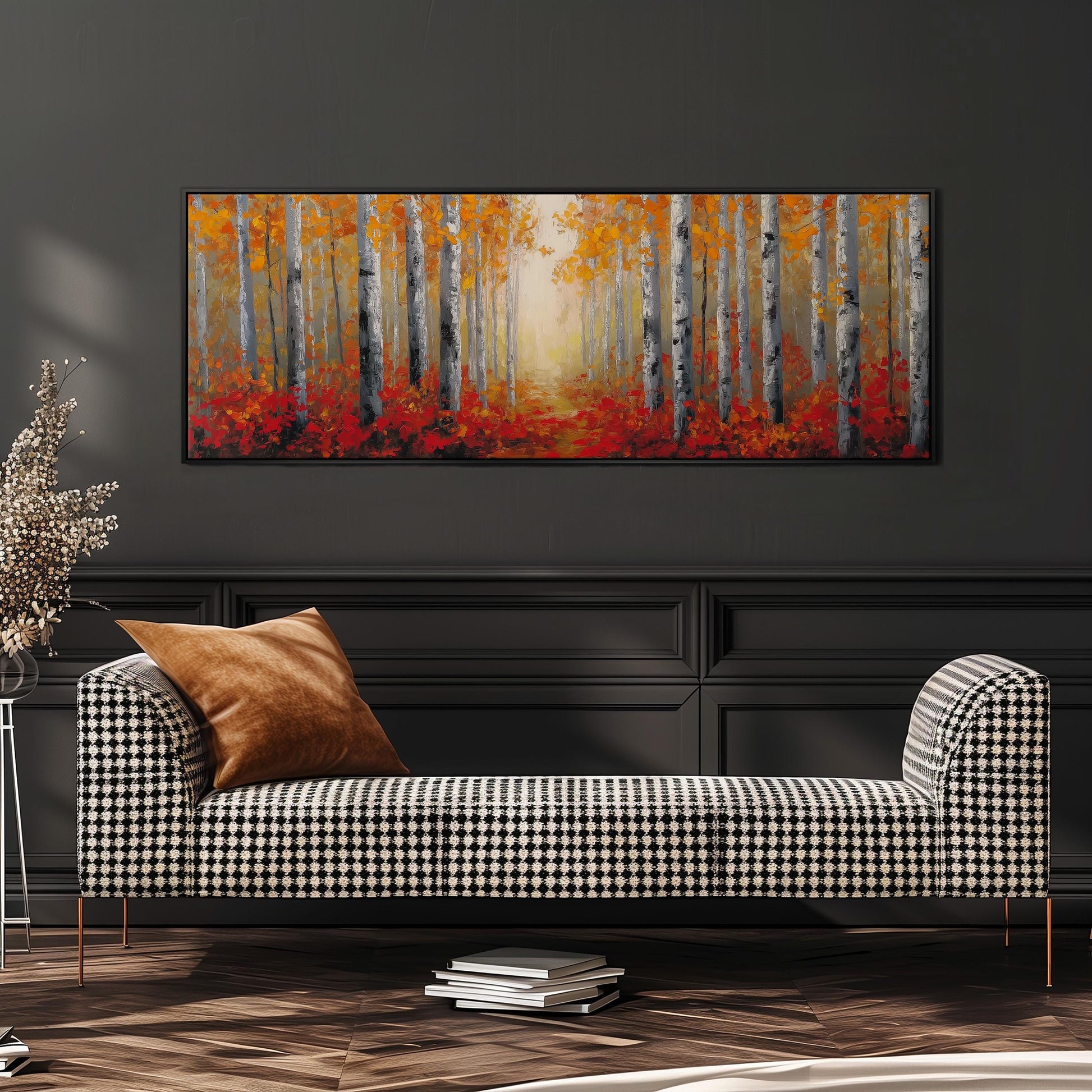 a large painting of a forest with a path leading through it, hanging on a wall above a black and white checkered sofa.