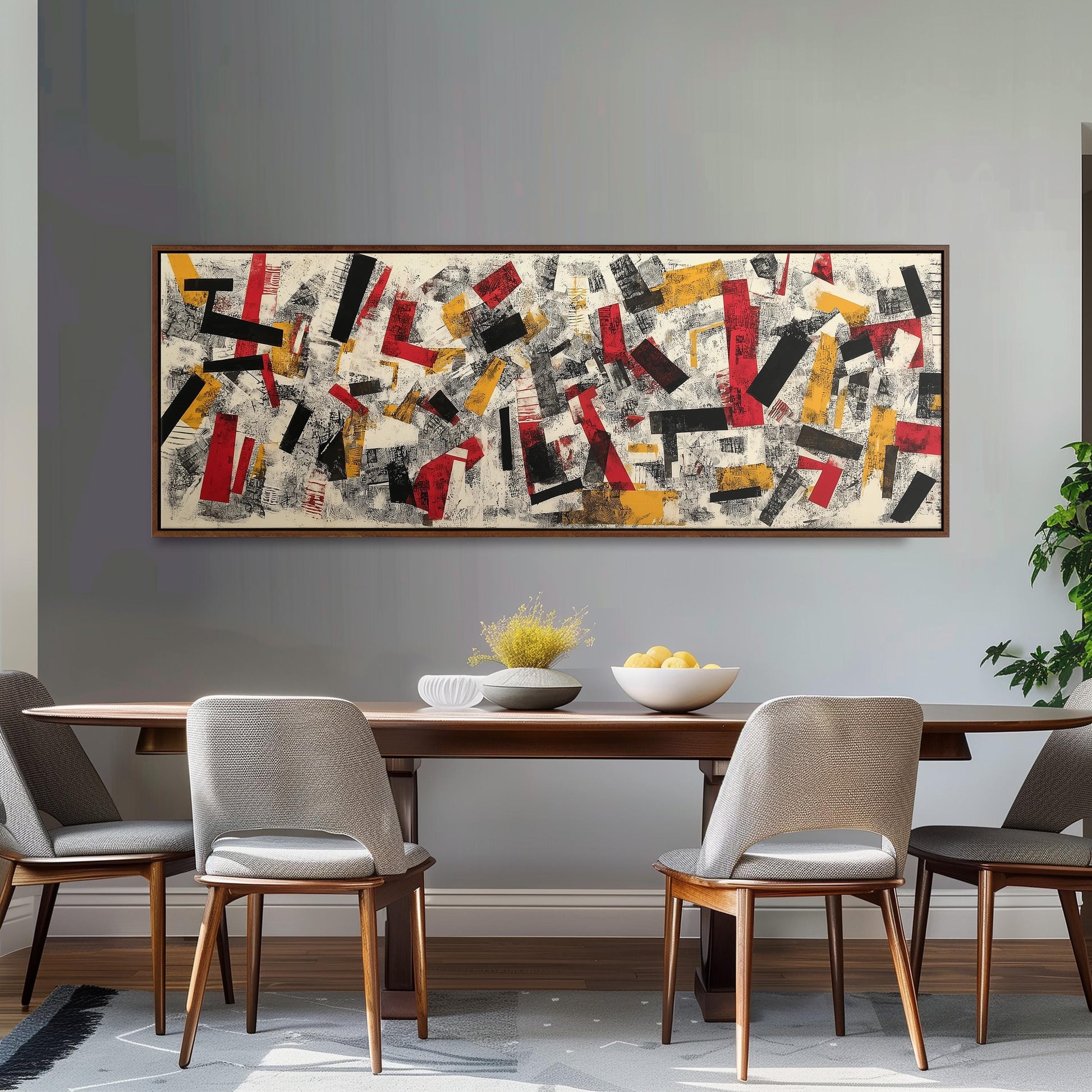 a modern dining room with a large abstract painting hanging on the wall above a wooden dining table. The table is set with a bowl of fruit and a vase of flowers, creating a welcoming atmosphere. The room is furnished with four chairs, two on each side of the table, and a potted plant is placed on the right side of the room.