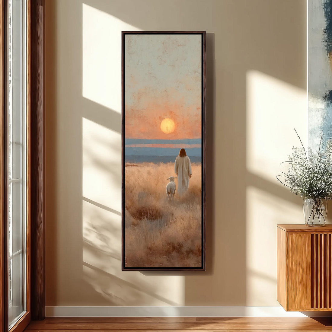 a serene indoor setting with a large painting of a person in a long white robe standing in a field, gazing out at the sunset. The painting is framed and hangs on a white wall, with a window and a chair visible in the background.