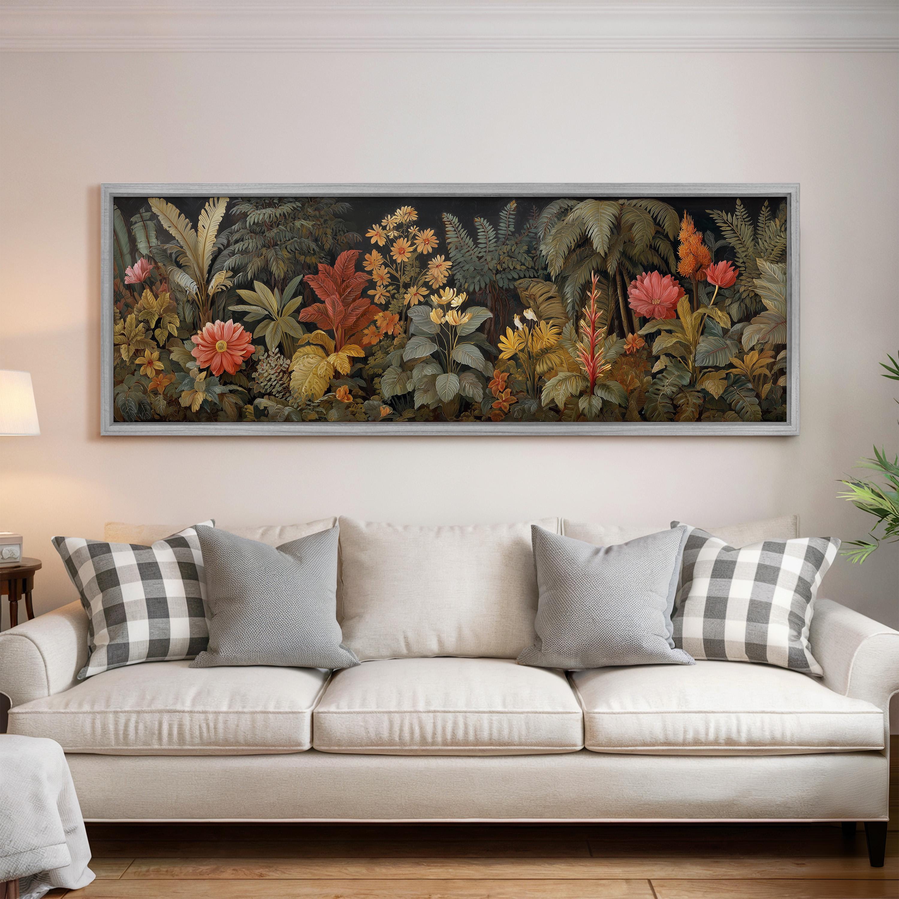 a large, framed painting of a lush, tropical garden hanging on a wall above a white sofa with gray and white plaid throw pillows.