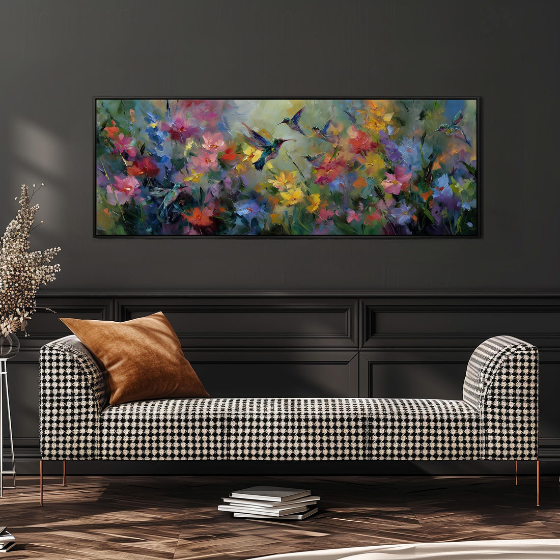 a large, colorful painting of flowers hanging on a wall above a black and white checkered sofa in a living room setting.