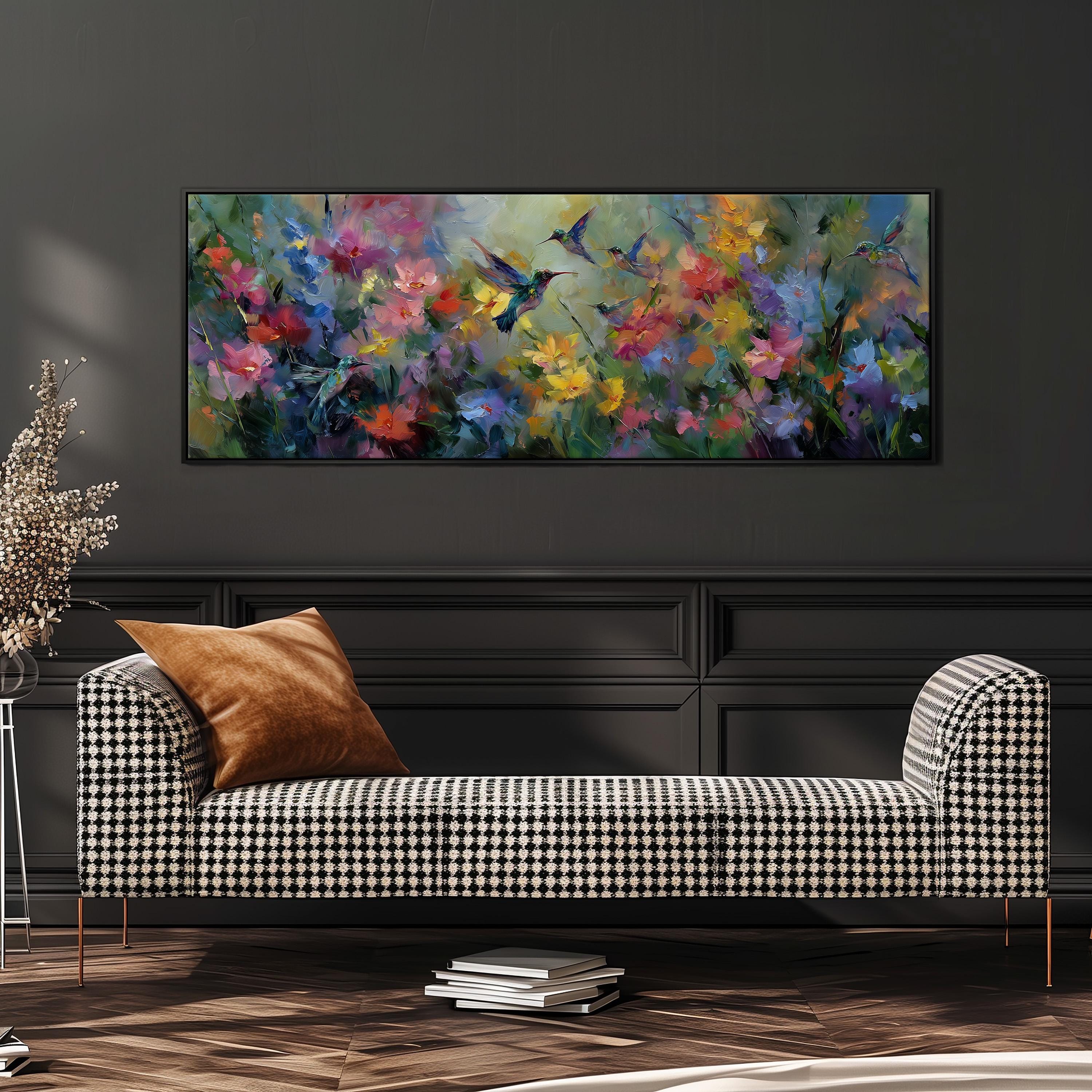 a large, colorful painting of flowers hanging on a wall above a black and white checkered sofa in a living room setting.