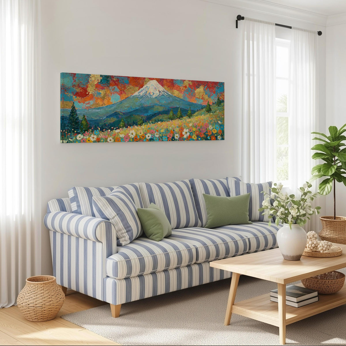 Mount Fuji under a red and gold sunset sky long horizontal canvas print above a striped sofa in a coastal living room