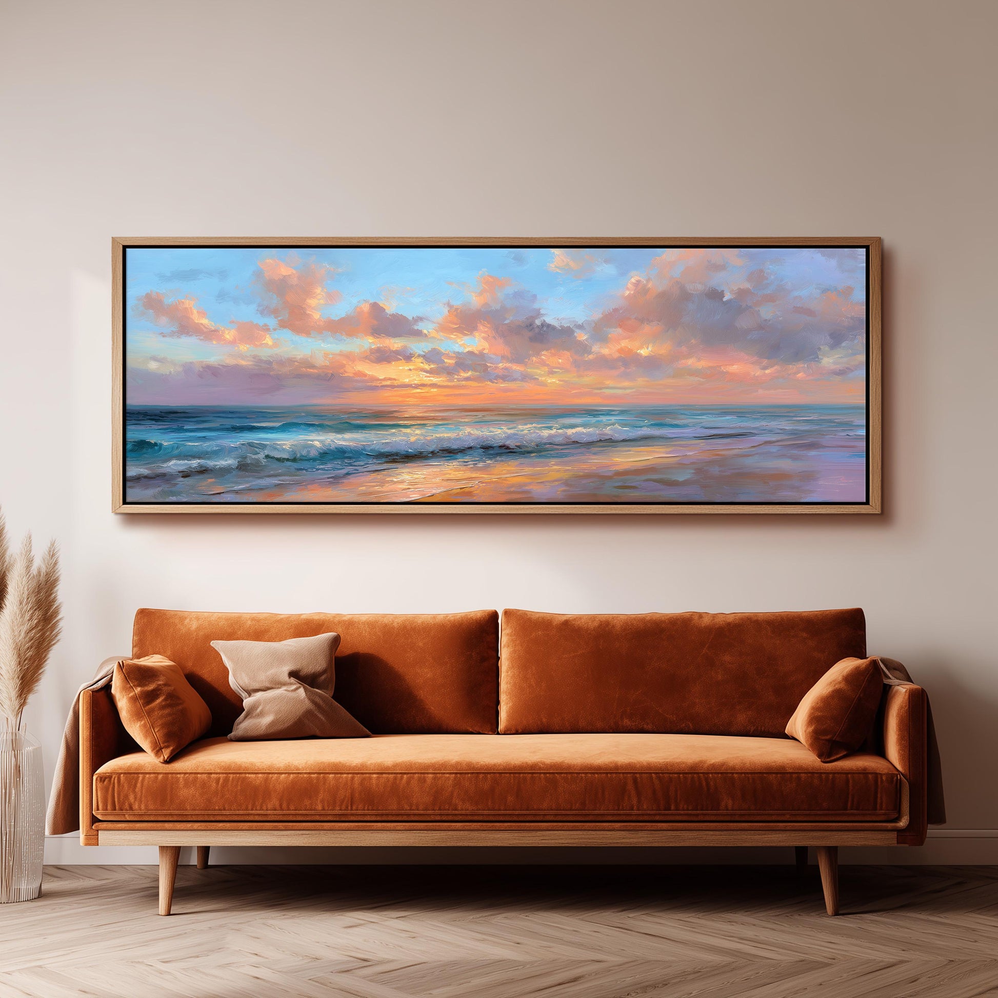 a large, rectangular painting of a serene beach scene hanging on a wall above a brown sofa.