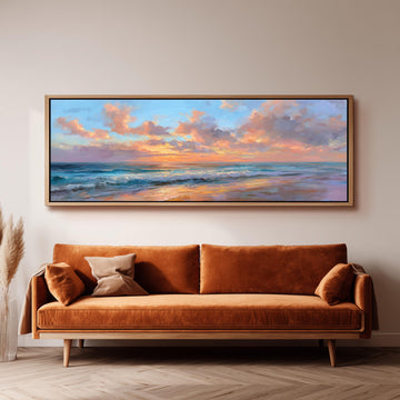 a large, rectangular painting of a serene beach scene hanging on a wall above a brown sofa.