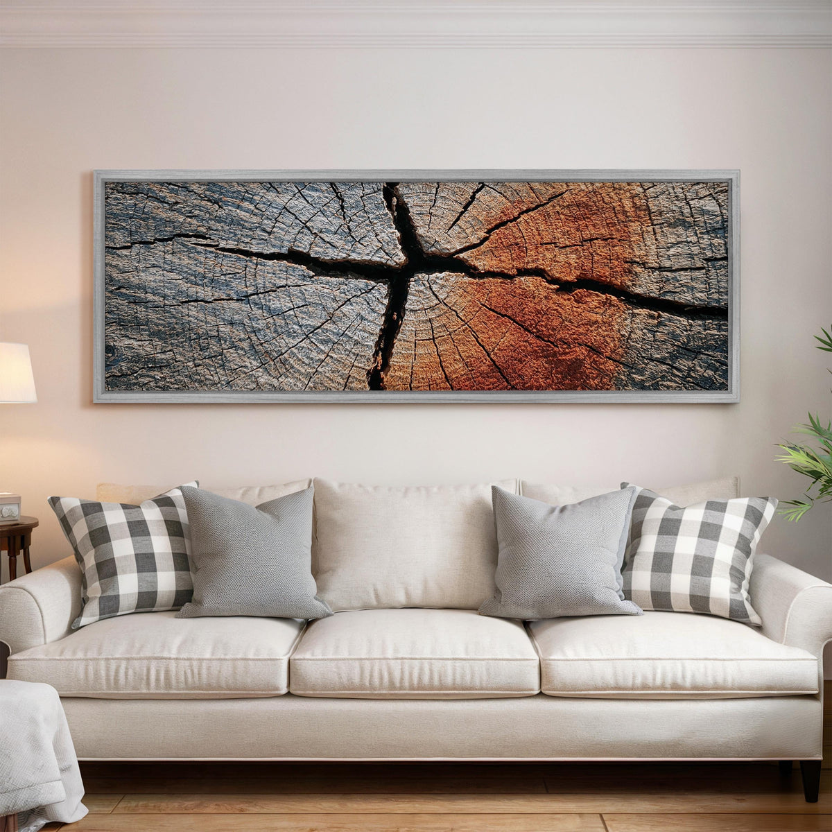 Copper cracked wood grain panoramic canvas print above a white sofa in a bright living room