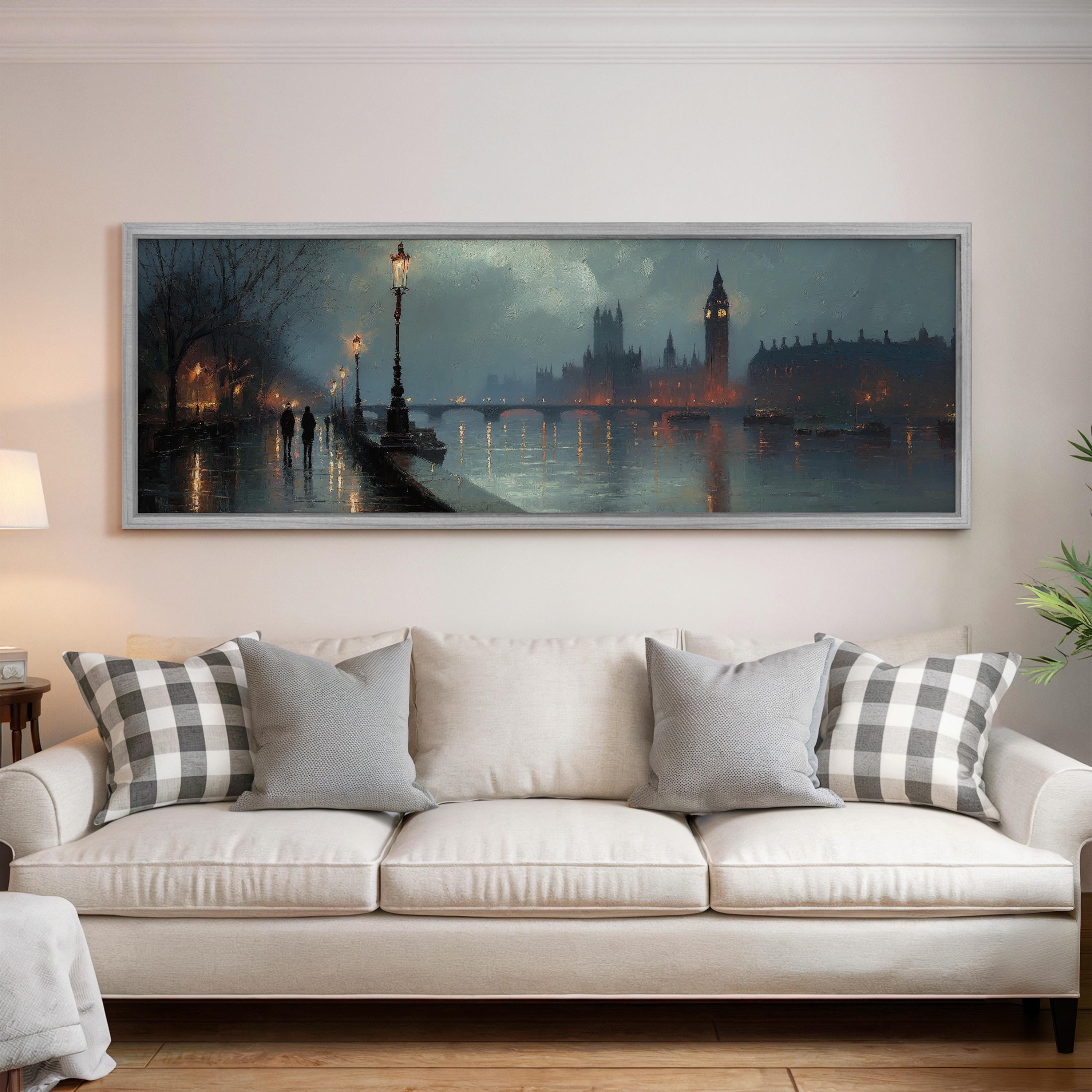 a large painting of a cityscape with a river and a clock tower in the background, hanging on a wall above a white sofa with patterned throw pillows.