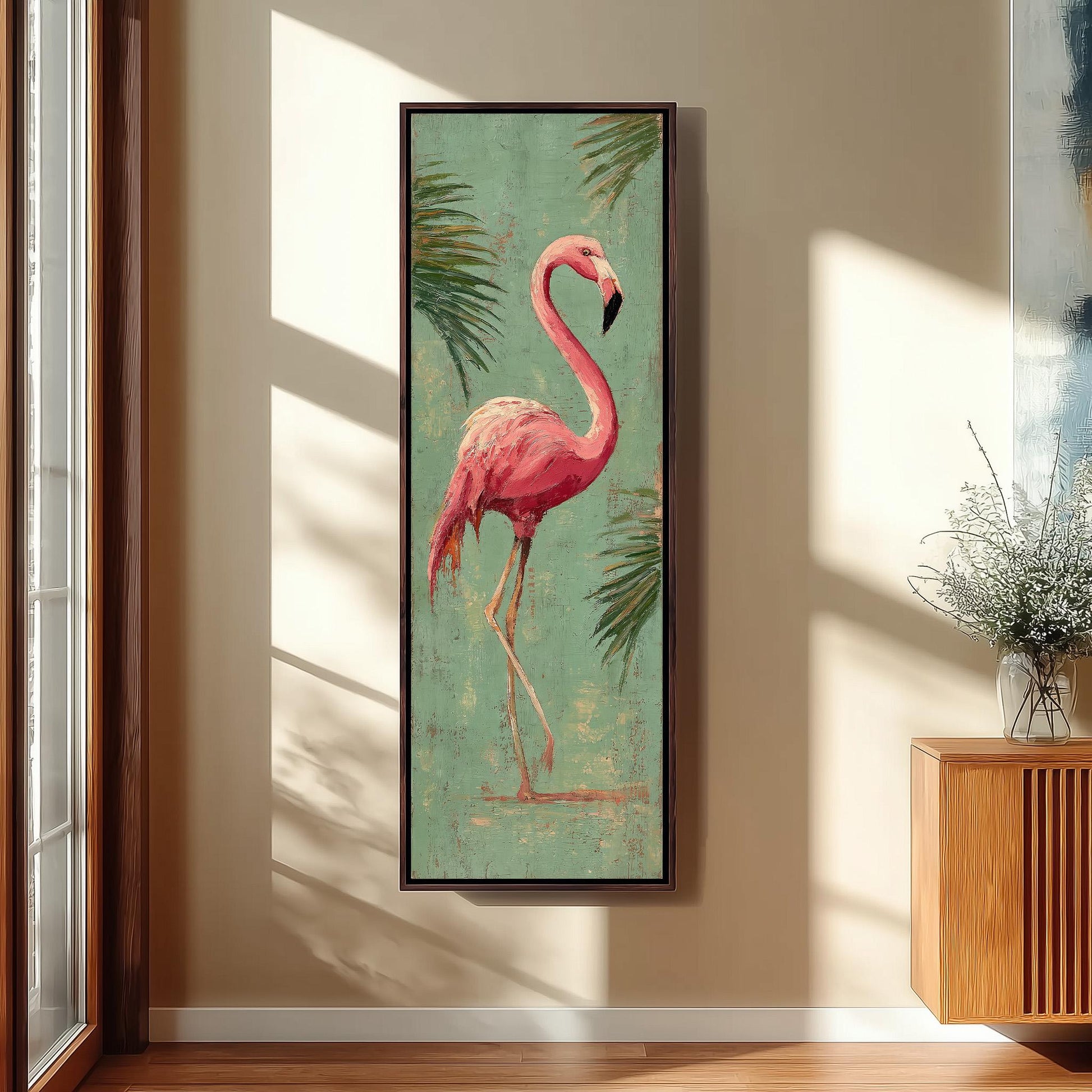 a large framed painting of a pink flamingo standing on one leg against a green background with palm leaves.
