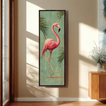 a large framed painting of a pink flamingo standing on one leg against a green background with palm leaves.