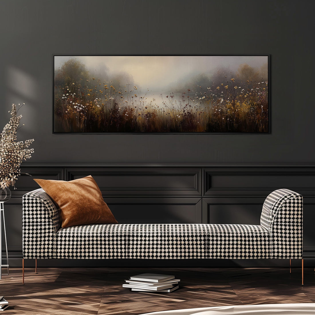 a black and white checkered sofa with a brown throw pillow, set against a dark wall with a large painting of a field of flowers hanging above it.