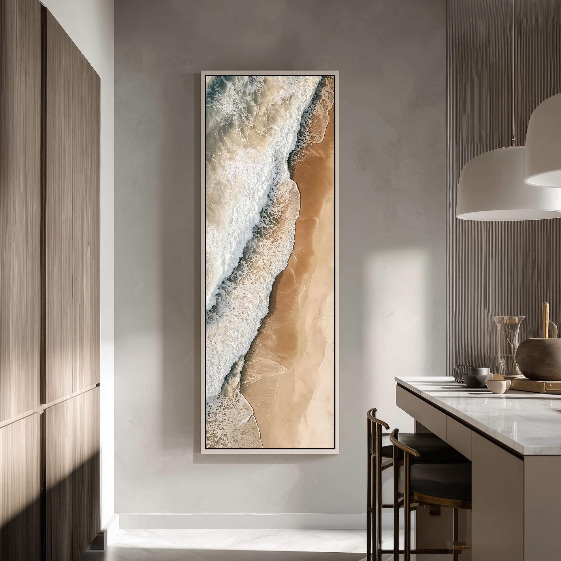 a large, framed painting of a beach scene hanging on a wall in a modern, minimalist kitchen.