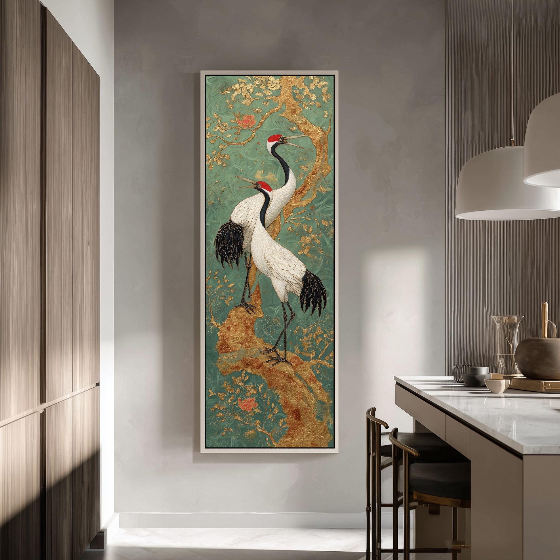 a large framed painting of two white birds with black and red accents, standing on a branch with flowers, hanging on a wall in a modern kitchen.