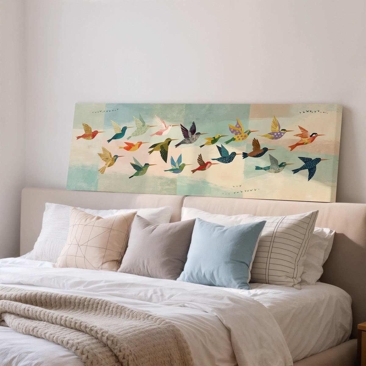 Flock of colorful hummingbirds wide panoramic canvas print above a bed in a bedroom
