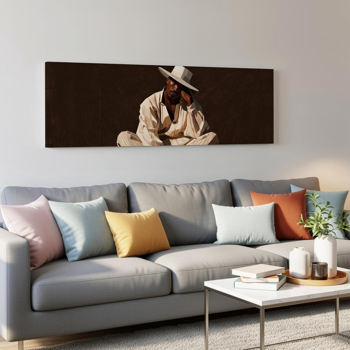 Pensive man in a white hat on brown panoramic canvas print above a grey sofa in a living room