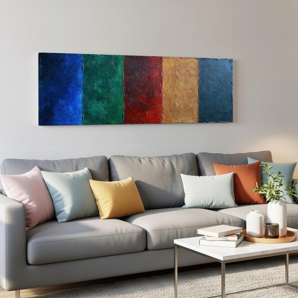 Textured jewel tone vertical bands panoramic canvas print above a grey sofa in a living room
