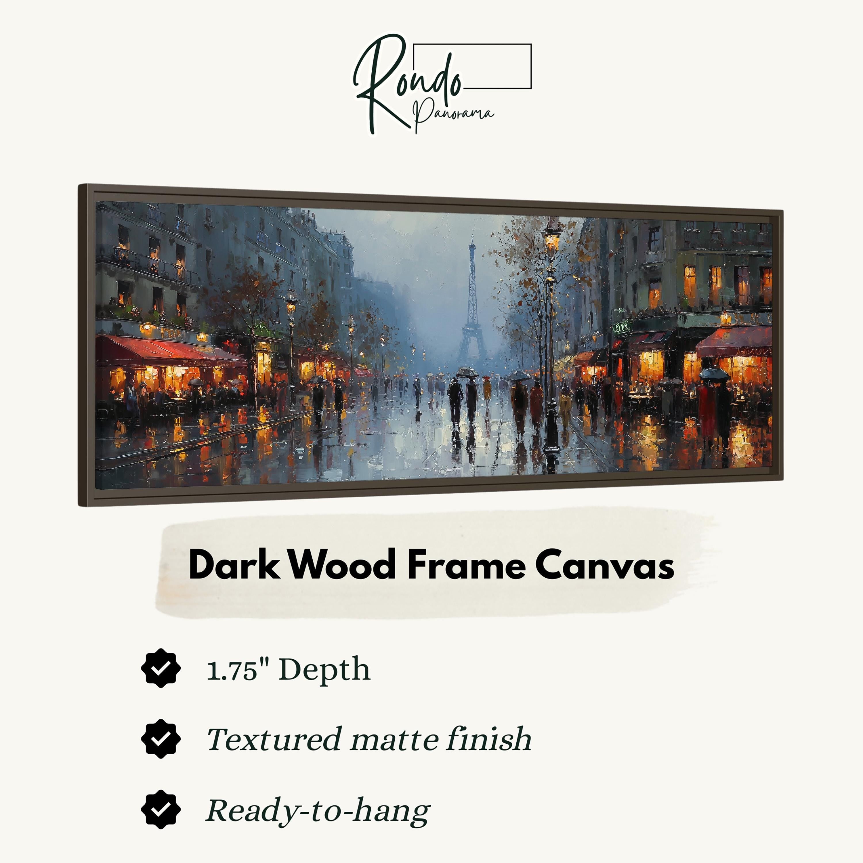 The image is a dark wood frame canvas depicting a rainy city street scene with people walking and umbrellas, with the Eiffel Tower visible in the background.