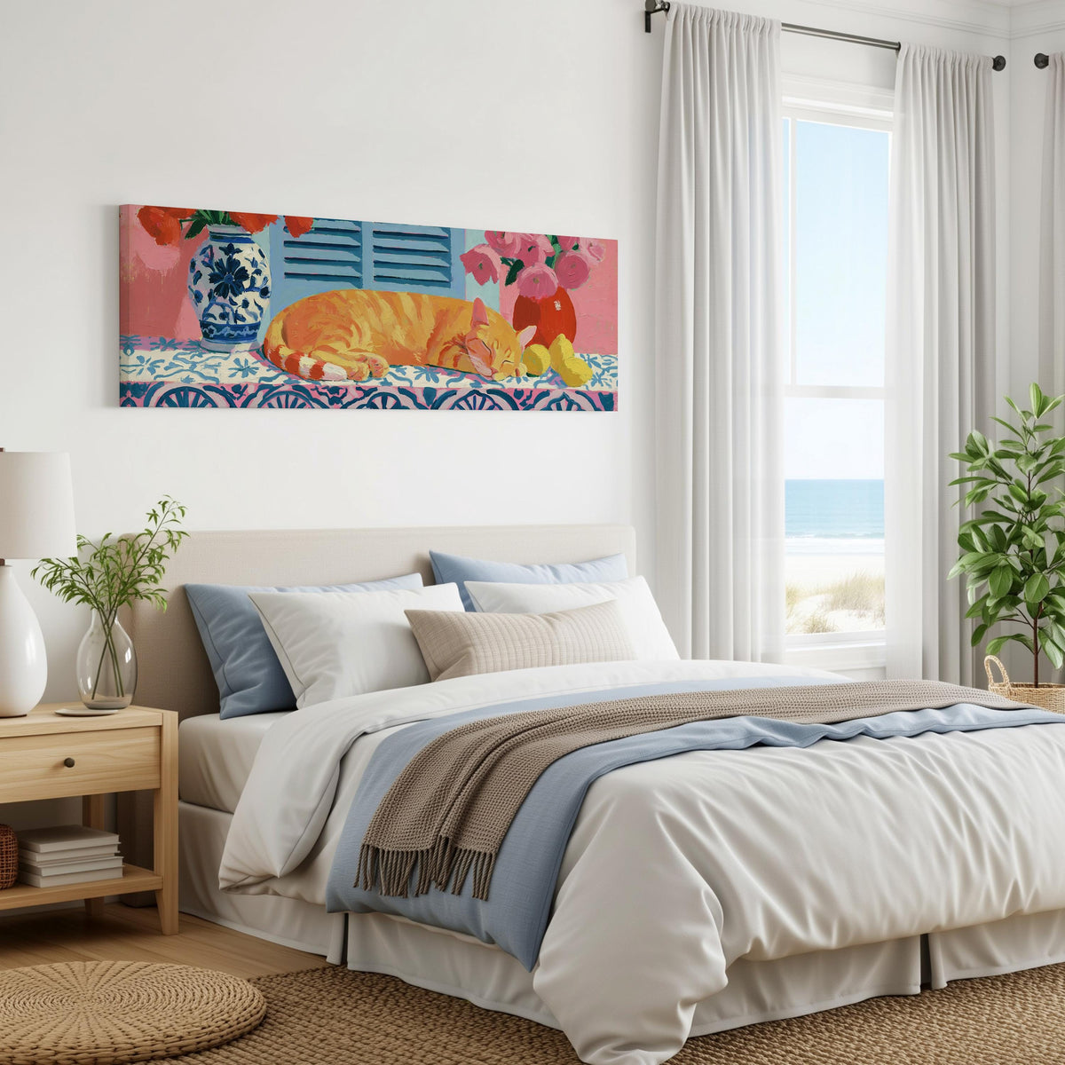 Orange cat napping on a tiled table panoramic canvas print above a bed in a coastal bedroom