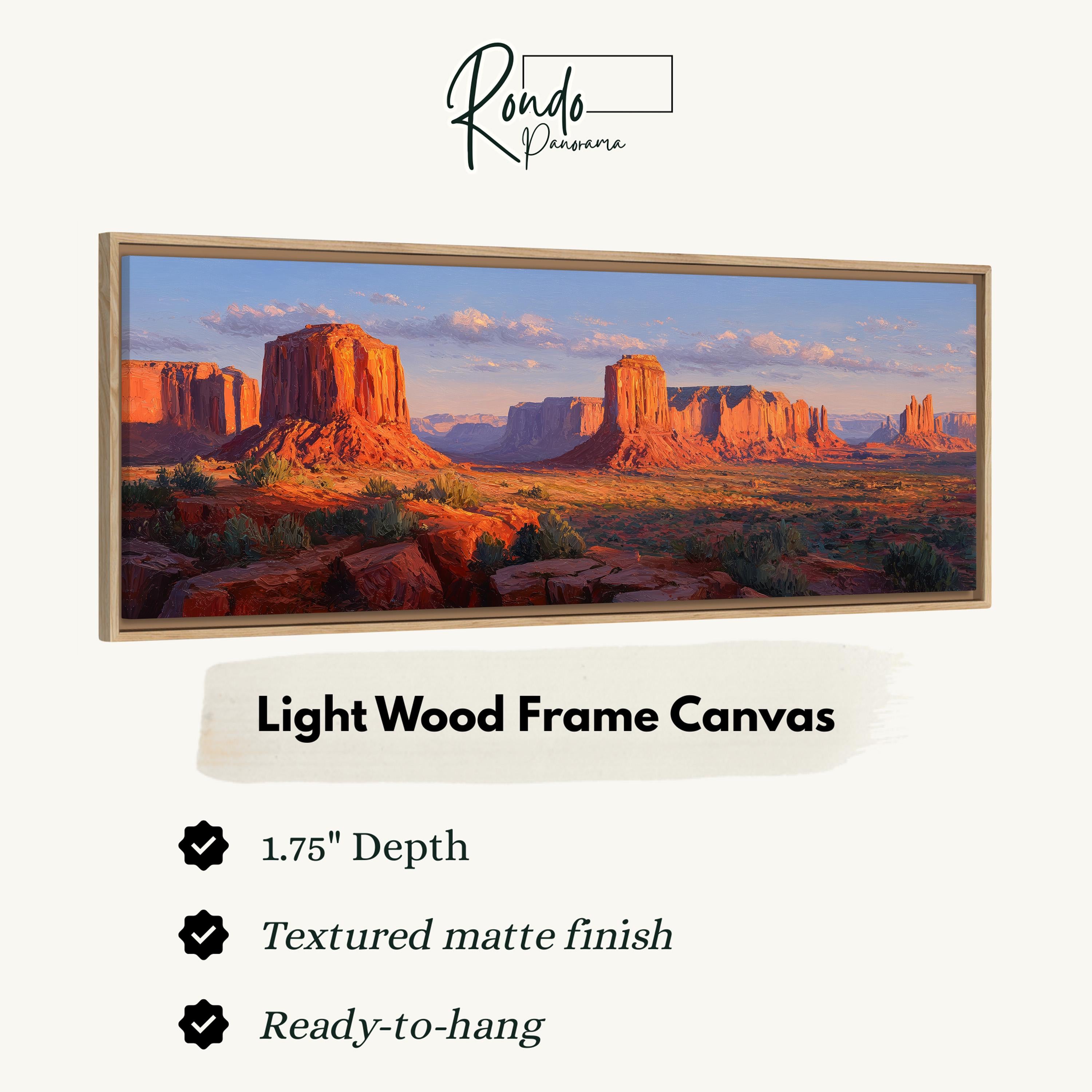 The image is a framed canvas depicting a desert landscape with mountains in the background.