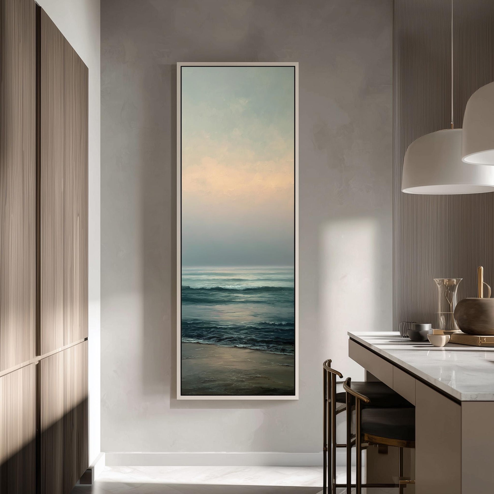 a large, framed painting of a serene ocean scene hanging on a wall in a modern kitchen.
