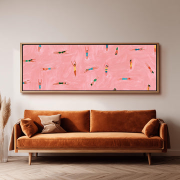 Tiny swimmers in a pink pool from above long horizontal canvas print above a sofa in a living room