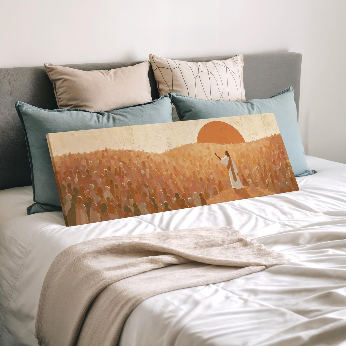 Jesus preaching to a crowd at sunset wide panoramic canvas print laid on a bed to show its size