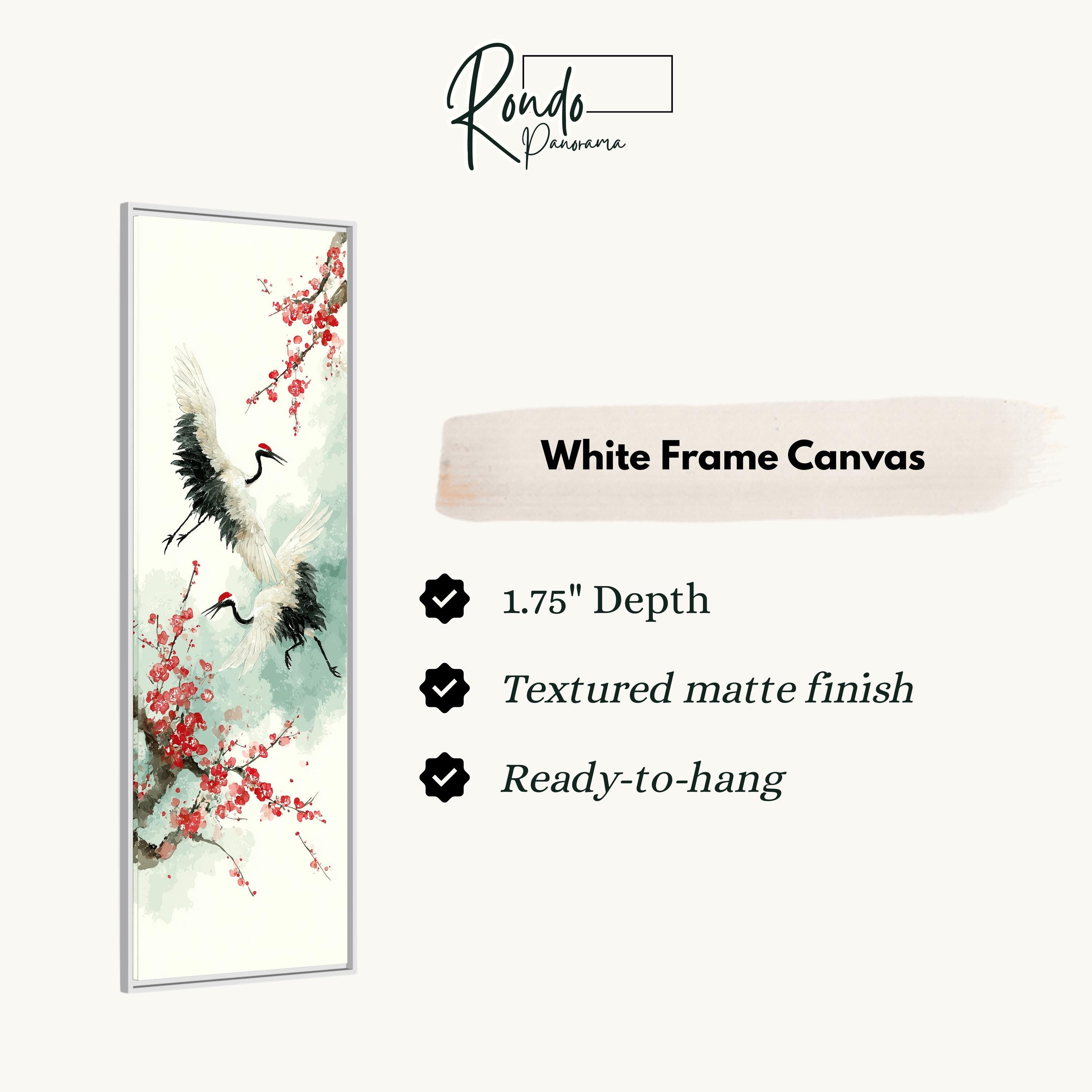 The image is a white frame canvas featuring a painting of two cranes in flight with red flowers on a branch.