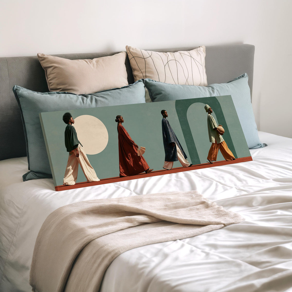 Women walking past arches and a pale moon wide panoramic canvas print laid on a bed to show its size