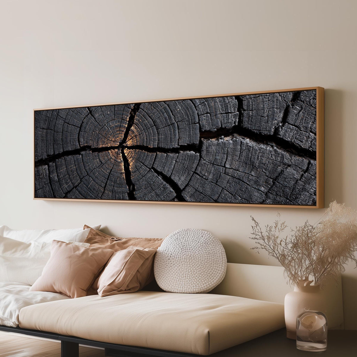 Charcoal tree ring cross section long horizontal canvas print above a sofa in a living room