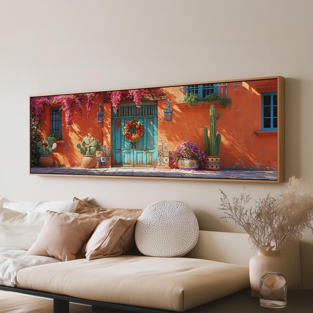 Adobe doorway with a wreath and cacti long horizontal canvas print above a sofa in a living room