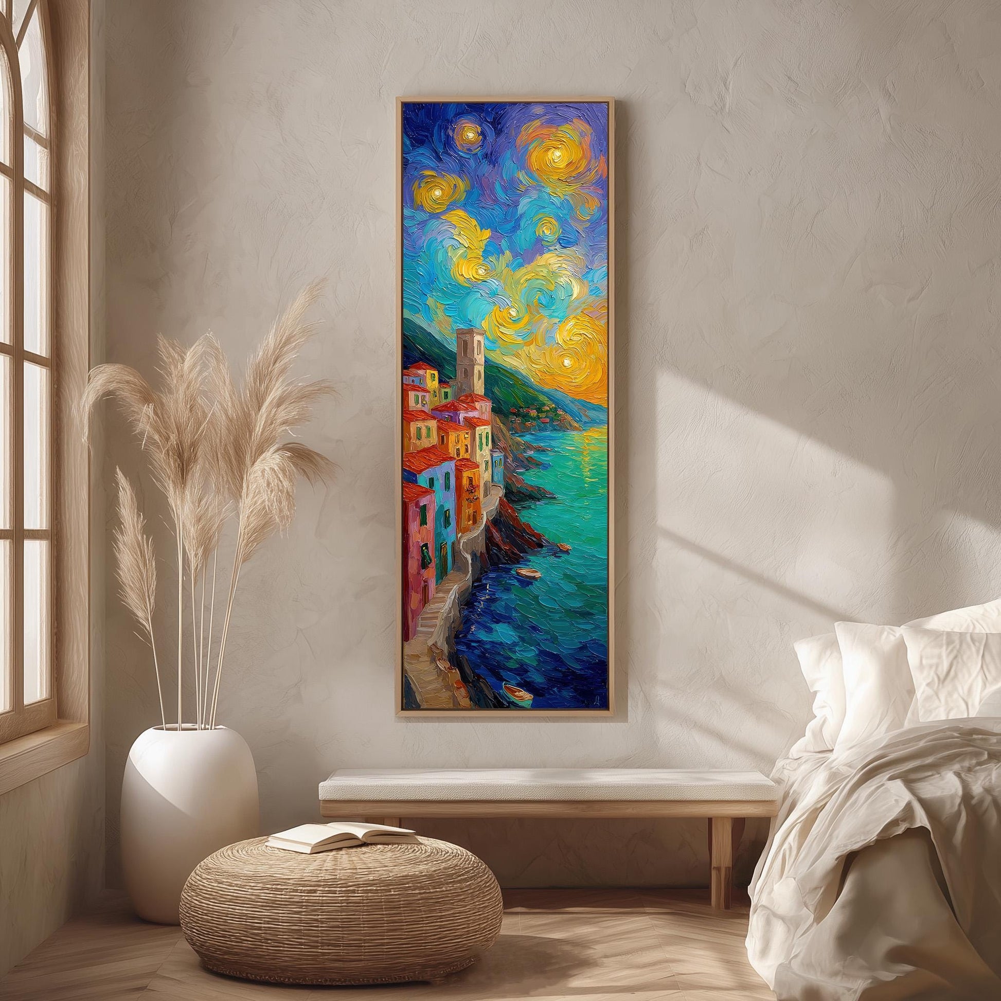a large, colorful painting of a coastal town with a starry sky above, hanging on a wall in a room with a window, a bench, and a potted plant.