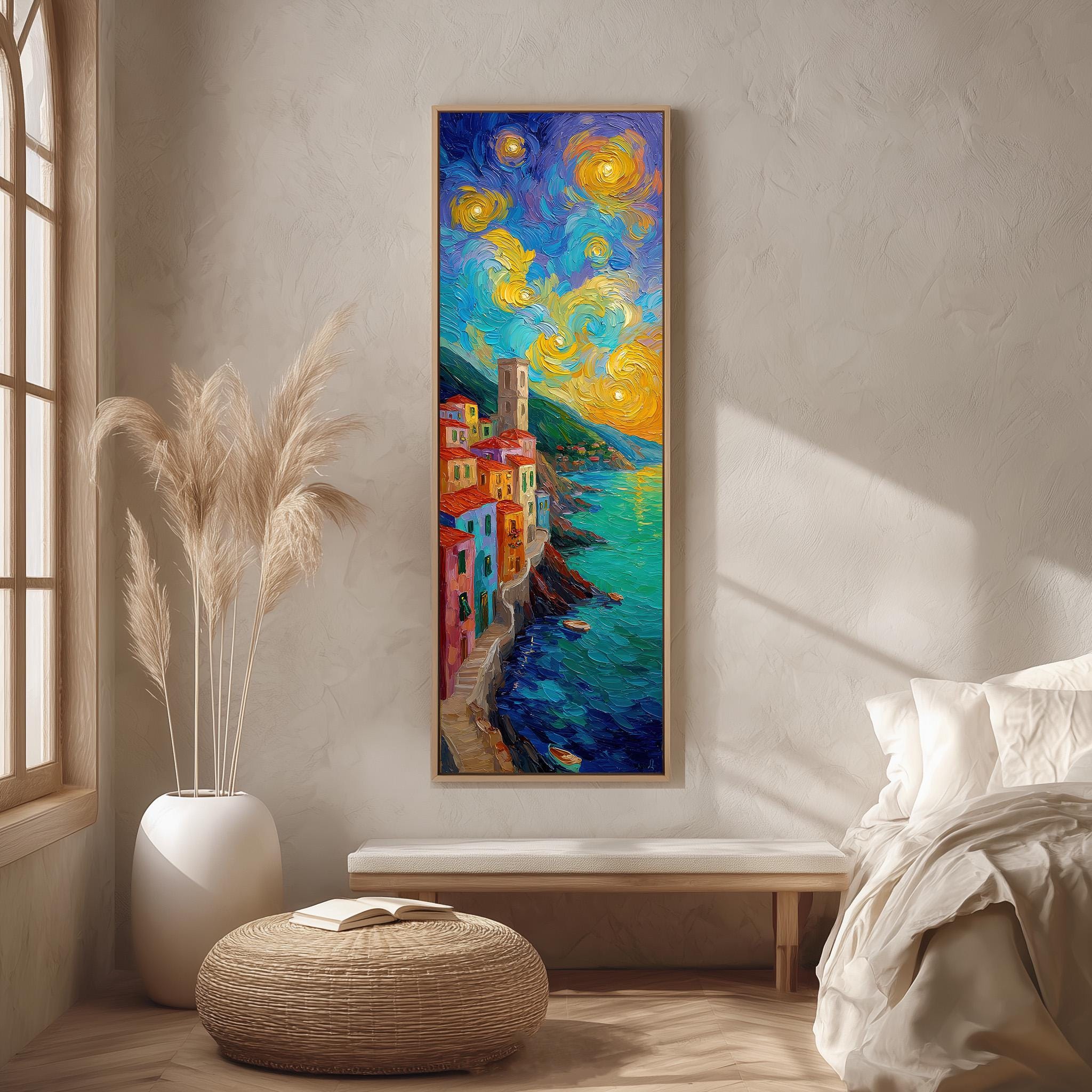 a large, colorful painting of a coastal town with a starry sky above, hanging on a wall in a room with a window, a bench, and a potted plant.