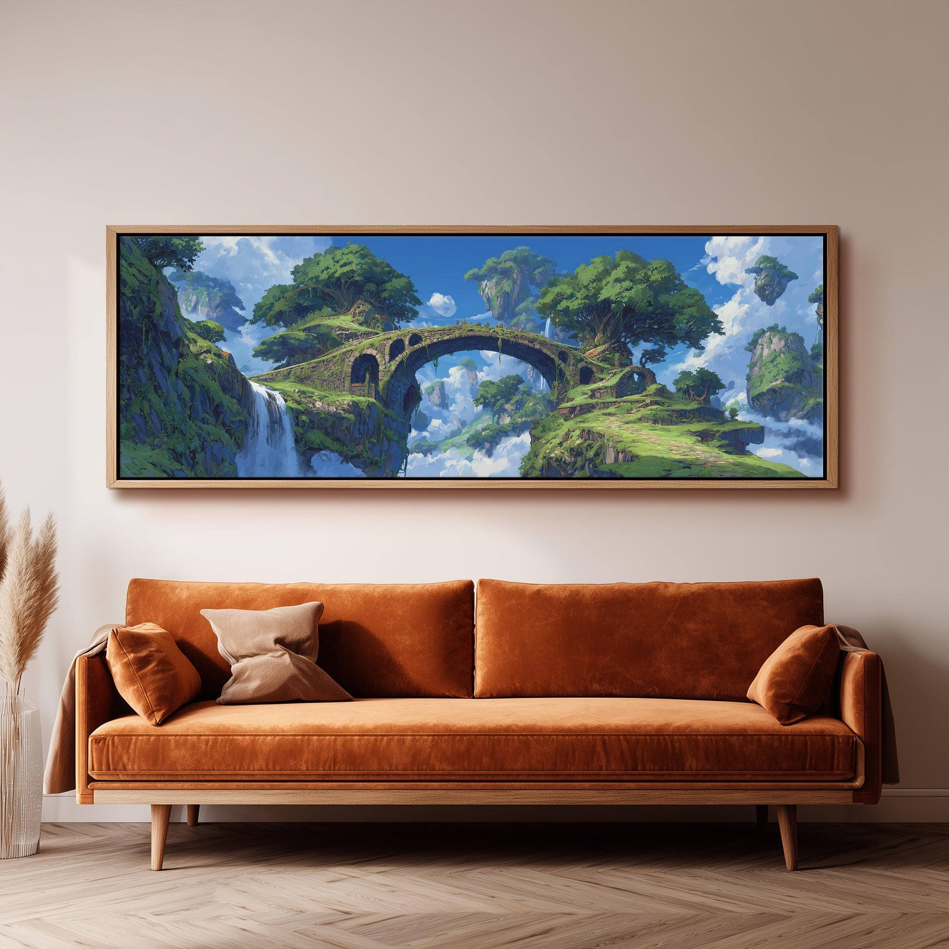 a large, framed painting of a fantastical landscape with a bridge, trees, and a waterfall. The painting is hung on a wall above a brown sofa, creating a cozy and artistic atmosphere in the room.