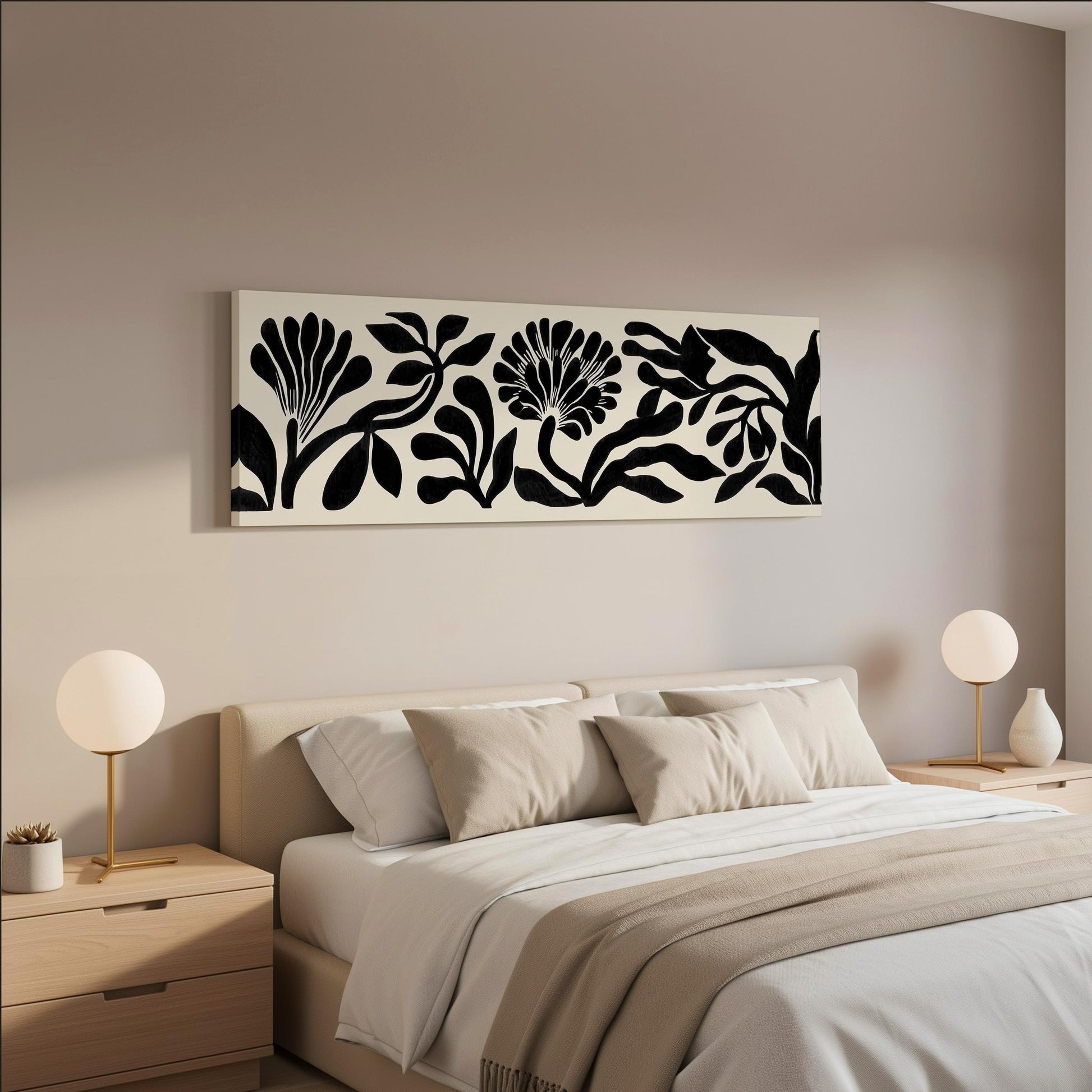 a modern bedroom with a large bed, two nightstands with lamps, and a large black and white floral artwork hanging on the wall above the bed.